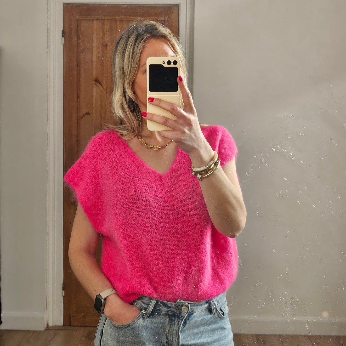 Pull sans manches col V rose fuchsia
